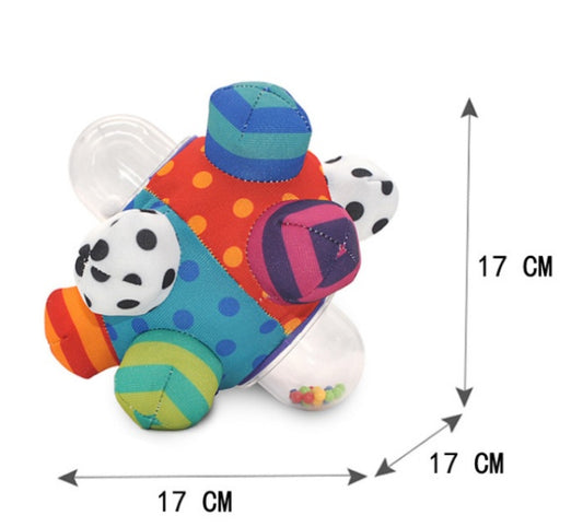 Baby hand catching rattle ball