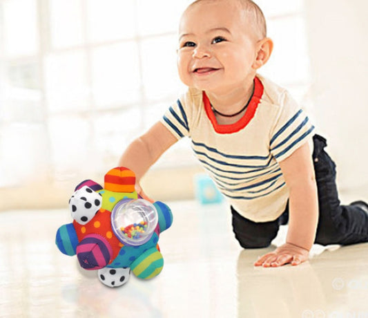 Baby hand catching rattle ball